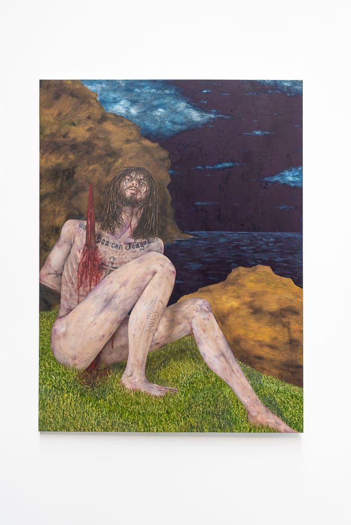 Painting of a long-haired, bearded human figure with arms behind their back and a bloody stake in their chest, sitting on a grassy cliff overlooking a dark ocean and sky. They have tattoos of "Only God can Judge me" and a cross on their chest, and Homer Simpson on their right leg.
